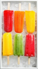 Six colorful fruit popsicles rest on a bed of crushed ice, offering a vibrant, refreshing treat.