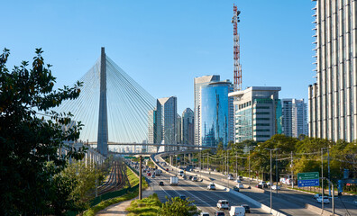 Cityscape with cable-stayed bridge, and city traffic in S&atilde;o Paulo.