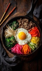 Delicious Bibimbap: A Colorful Korean Rice Dish with Fresh Vegetables and Egg