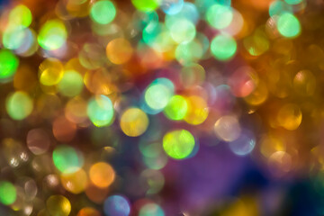 Blurred glowing spots create a golden bokeh effect perfect for joyful holiday and celebratory visual design