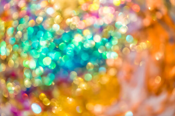 Warm glittering lights form a soft bokeh background with cheerful, festive sparkle and radiant glowing tones