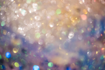 Golden festive lights produce a soft, shimmering bokeh effect with a cheerful mood and glowing...
