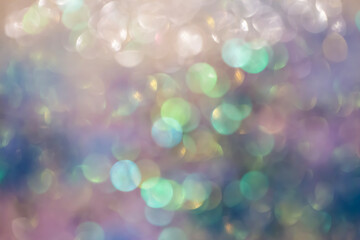 Obraz premium Out-of-focus glitter sparkles form a dreamy, radiant bokeh backdrop with warmth and elegant festive atmosphere