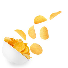 Tasty crispy potato chips falling into bowl on white background