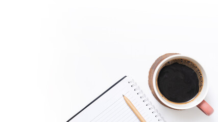 Flat lay, top view office table white desk. Workspace with notepad, pen, and coffee cup on isolated white background.