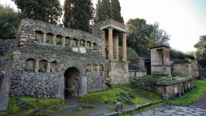 Pompeii, Italy - 8 January 2025. Tombs line the Porta Nocera necropolis, with arched niches and...