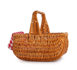 Wicker picnic basket and clean napkin on white background