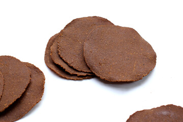 Fermented soybean discs, known as “Thua Nao,” a traditional Thai seasoning used to enhance flavor in Northern cuisine.