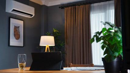 Cozy modern home office setup with tablet