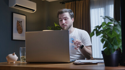 Man showing charts during online video presentation