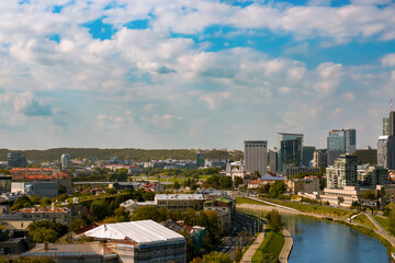 Aerial view of city houses over sky background