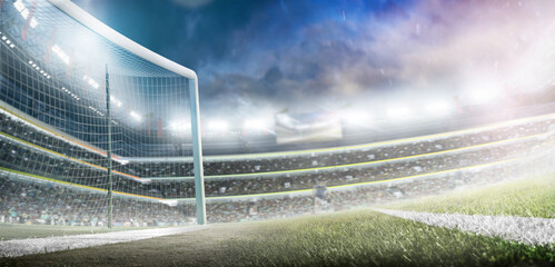 Beautiful professional football stadium. Football goals. Large sports arena. Professional sports advertising background with lights, fans and flags