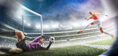Soccer players playing with ball at stadium. Soccer action game. Powerful blow. The goalkeeper...