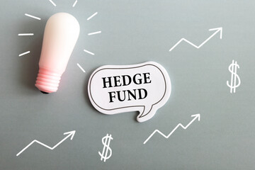 HEDGE FUND text on a note with office supplies
