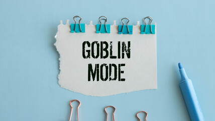 Work or goblin mode symbol. Concept word Work mode Goblin mode on wooden cubes.