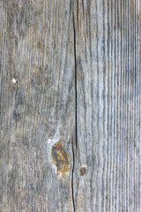 The image is of a wooden surface with a grainy texture