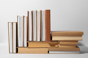 Many books on grey background