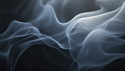 Fototapeta premium Abstract smoke swirls in shades of gray and white against a dark background