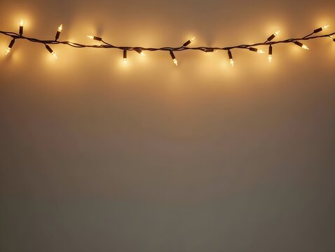 Warm golden fairy lights delicately strung across the top of the banner, emitting a cozy glow. The background remains muted with negative space for text.