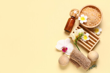 Naklejka na ściany i meble Composition with spa accessories, sea salt and beautiful flowers on color background