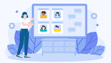 Woman video chats with three people on a large screen. Suitable for digital communication, remote work, virtual meetings, and technology concepts.