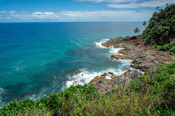 Rocky beach, blue sea on the coast of Bahia in Brazil