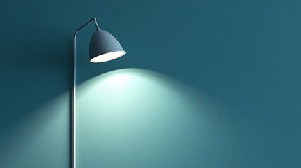 Floor lamp casting a spotlight on a teal wall.