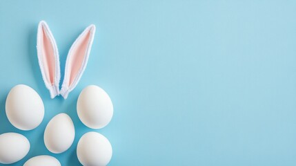 easter bunny ears white eggs on isolated pastel background with copyspace