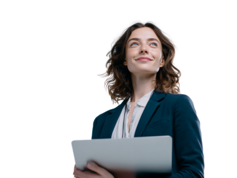 A woman in a business suit is holding a laptop and smiling