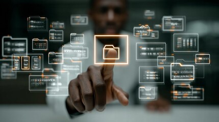 A man is pointing at a computer screen with a file icon