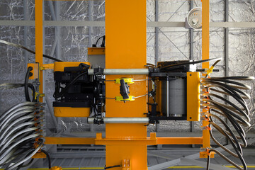 Overhead crane in factory or warehouse. Industrial machine or lifting equipment with hoist, hook and wire rope on beam girder structure for manufacturing production and freight shipping transport.