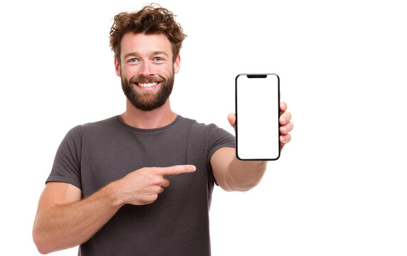 A man is holding a phone and pointing to it