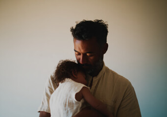 Father and baby child Embracing in Natural Light – Intimate Father's Day Moment