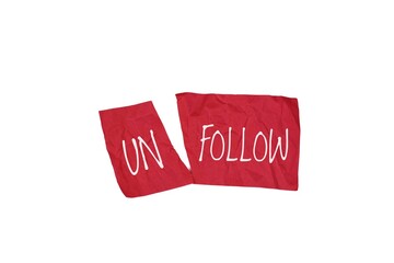 Red and Crumpled Paper Displaying the Word Unfollow in a white background