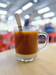 Traditional Malaysian Teh with Condensed Milk in Hawker Centre
