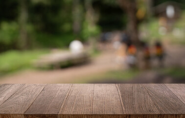 Empty wood table top and blur of restaurant background selective focus product display