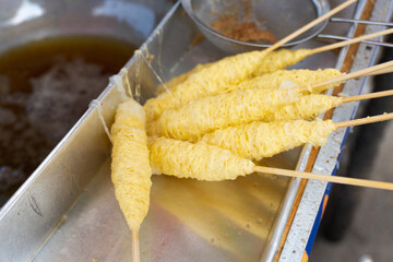 Telur Gulung is street food from indonesia that is made from eggs that mixed with bihun (rice noodles) and rolled with a skewers.