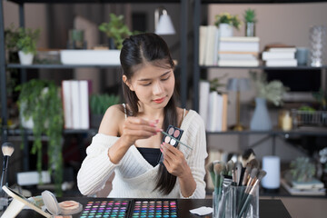 beauty blogger Young Asian girl makeup artist Professional Woman blogger vlogger is showing...