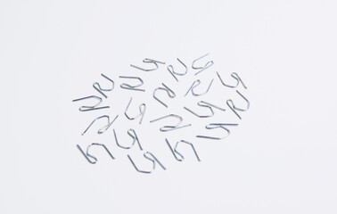 Metal hooks, used to attach curtains to curtain rod rings. 