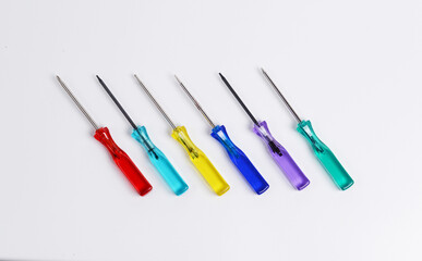 Precision screwdrivers with various tip shapes, used for repairing electronics specifically laptops.
