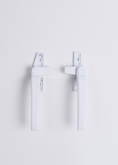 A pair of window handles made of aluminum alloy, design to facilitate the opening and closing of windows.