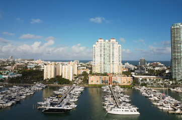 Naklejka premium Docked yacht in port of Miami. Marina luxury cityscape. Port with yacht. Yachting marina. Luxury yacht charter. Miami port marina. Luxury yachting in summer. Charming marina
