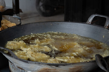 Process of frying bananas, cooked in hot oil