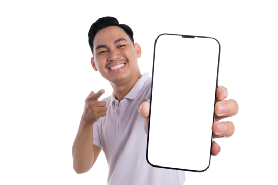 Cheerful young man pointing at blank smartphone screen and smiling isolated on transparent background