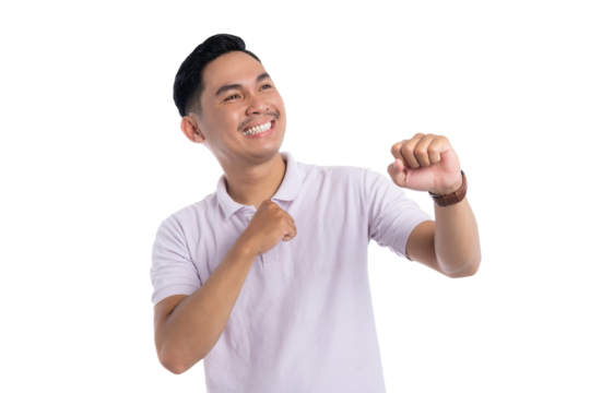 Excited young man smiling and celebrating success with fist pump gesture isolated on transparent background