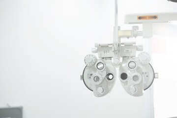 Phoropter for eye test, lenses glasses for eye check in optical store, health care, eye care concept, industry eye care 