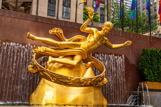Rockefeller Centre during Pride month. Prometheus sculpture fountain in the lower plaza. NYC, New York State, United States of America.