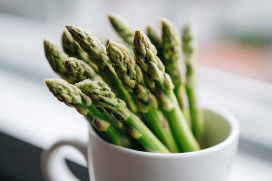 Asparagus in a white cup