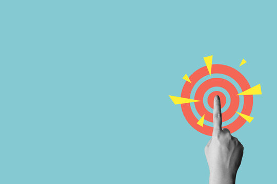 Human hand touching a dartboard on a colored background. Concept of taking action. Collage art