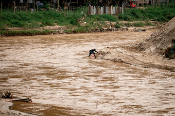 The Thai-Myanmar border during the construction of flood barriers by both Thailand and Myanmar to prevent flooding.